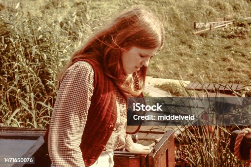 istock Young woman back in the seventies 1471650076