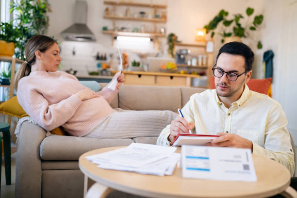 istock Pregnant couple having problem organizing their home finances during inflation 1471650602