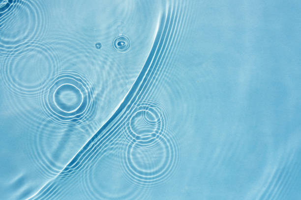istock Abstract background with blue water texture with ripples, circles, drops 1471651085