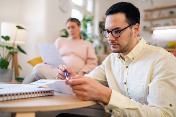 istock Pregnant couple having hard time with home finances during inflation 1471651177