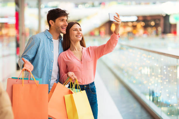 istock Spouses Making Selfie On Cellphone Shopping Spending Time In Mall 1471651299
