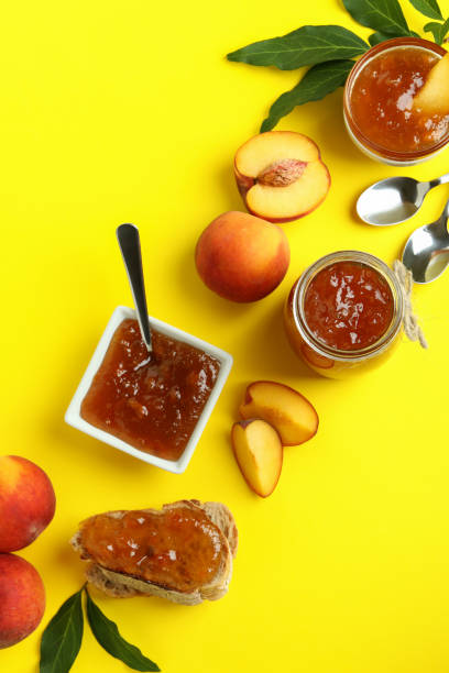 istock Peach jam and ingredients on yellow background 1471651700