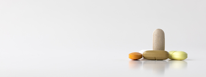 Pills on white background.