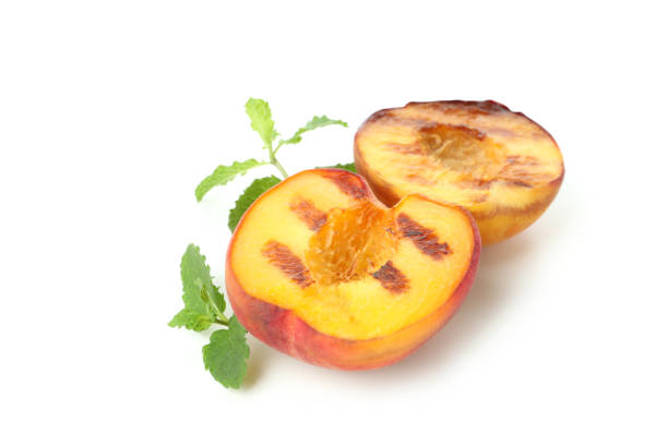 istock Tasty grilled peach isolated on white background 1471652648