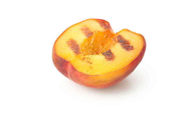 istock Tasty grilled peach isolated on white background 1471652686
