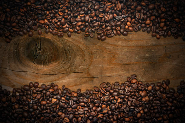 Frame of Roasted Coffee Beans on a Wooden Background stock photo