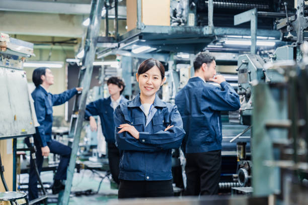 istock A smiling woman worker at a factory 1471653108