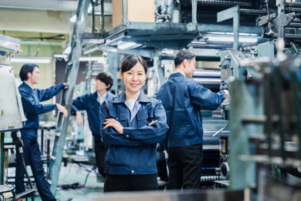istock A smiling woman worker at a factory 1471653109