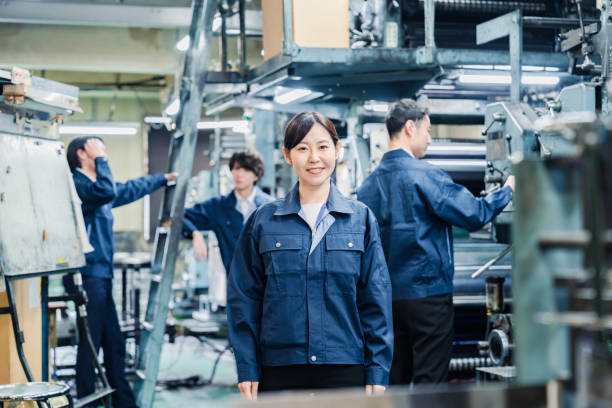 istock A smiling woman worker at a factory 1471653113