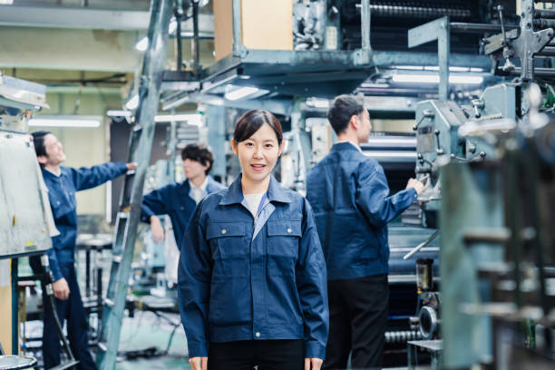 istock A smiling woman worker at a factory 1471653116