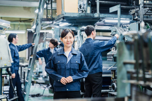 istock A smiling woman worker at a factory 1471653122