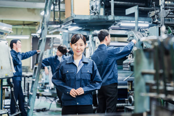 istock A smiling woman worker at a factory 1471653135