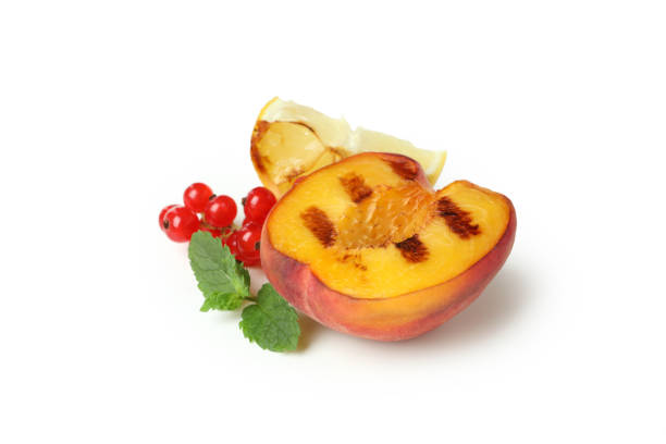 istock Tasty grilled peach isolated on white background 1471653379