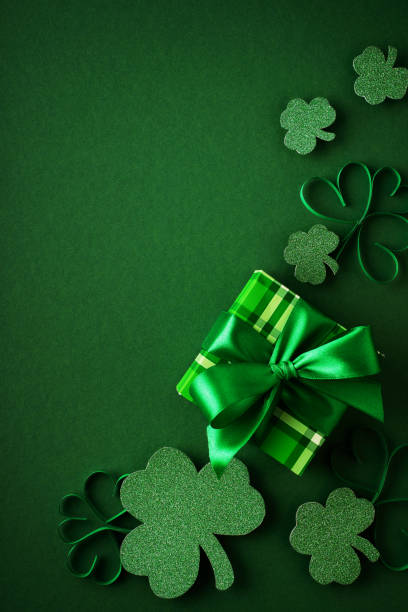 istock Saint Patrick day concept flat lay with green gift box close up on yellow background, 1471653707