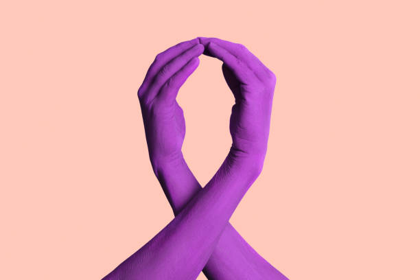 istock hands forming a violet awareness ribbon 1471655546