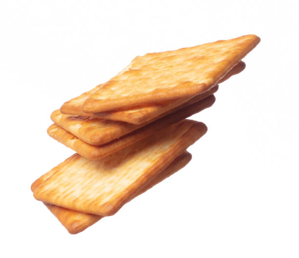 istock Cracker Butter square fall fly in mid air, golden crispy cracker Butter floating. Cracker Butter complete square throw in air. White background isolated freeze motion high speed shutter 1471658120