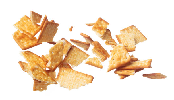 istock Cracker Butter square fall fly in mid air, golden crispy cracker Butter square floating. Cracker Butter crack crunch throw in air. White background isolated freeze motion high speed shutter 1471659340