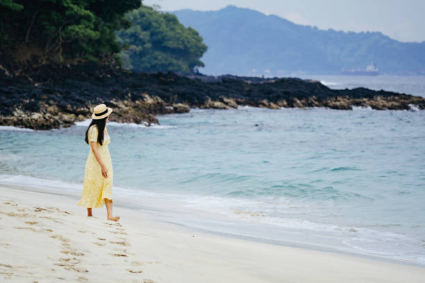 woman walking  on the beach