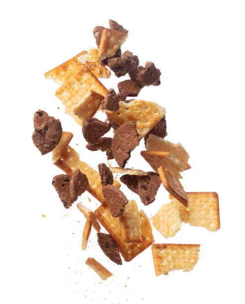 istock Mixed Cracker Butter Cookie Chocolate chip fall fly in mid air, cookie cracker floating. Mixed Cracker Butter Cookie Chocolate chip crack crunch throw in air. White background isolated freeze motion 1471659658