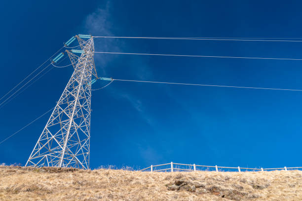 istock Electricity pylons in mountains. 1471661546