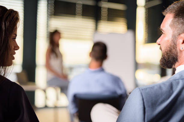 istock Two colleague talking on business seminar in board room 1471665219