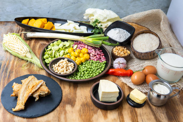 still life with ingredients to prepare fanesca. traditional ecuadorian food eaten at easter - baking flour ingredient animal egg imagens e fotografias de stock