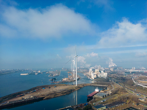 Coal power plant, wind turbines  and environmental pollution,  drone shot.