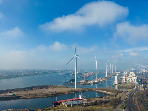 Coal power plant, wind turbines  and environmental pollution,  drone shot.