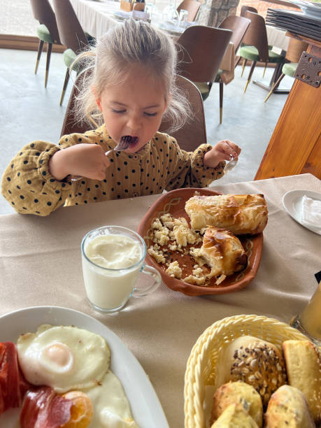 istock Little girl eats gibanica with a fork 1471668672