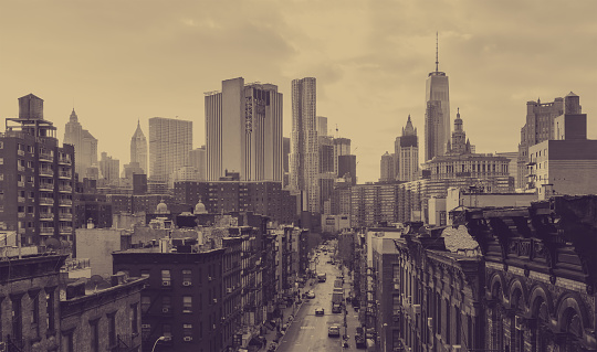 New York City overhead view of Madison Street in Chinatown and the downtown skyline buildings with a faded sepia color effect