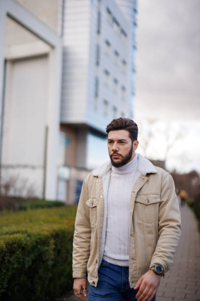 istock Young handsome man walking in the city 1471672715