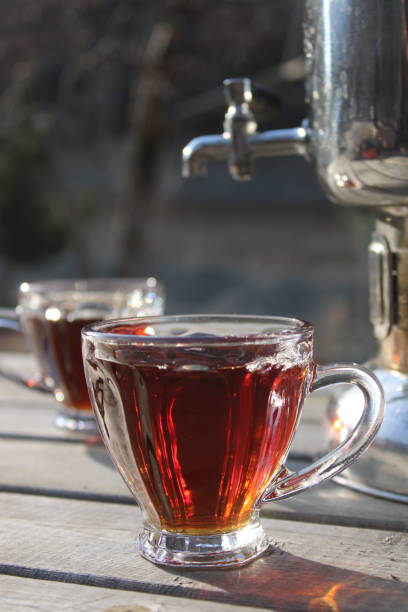 istock A cup of tea sits on a table with a tap attached to it. 1471674859