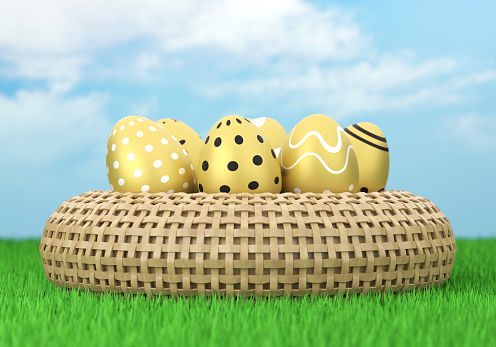 Easter Eggs And Basket On The Grass