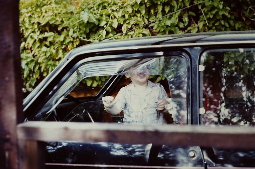 Family traveling by car in the seventies