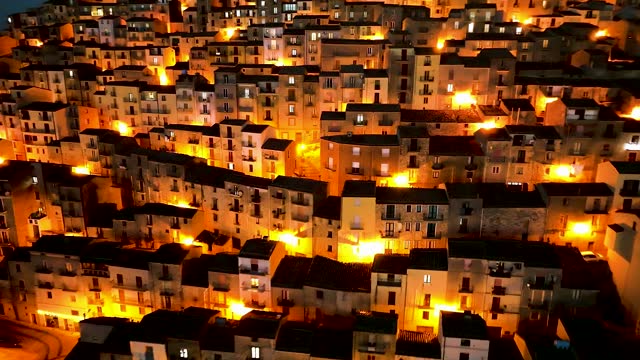 Aerial view of Gangi, a town on the hill at night, Sicily, Italy.
