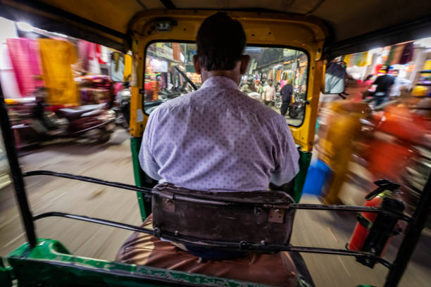 istock Indian man drives auto rickshaw (tuk-tuk), India 1471675338