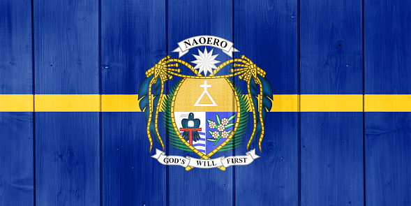 Nauru flag on a textured background. Concept collage.