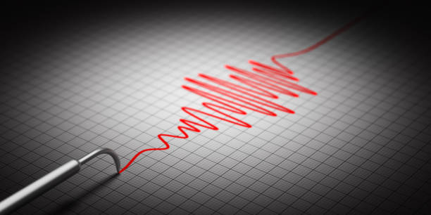 seismograph recording ground motion and earthquake activity on grid paper - seismologist imagens e fotografias de stock