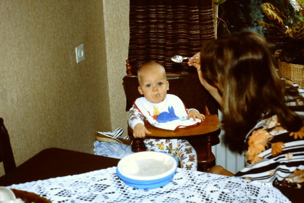 istock Young mother feeding her baby boy 1471676318