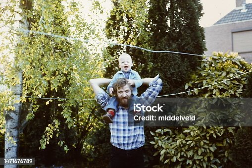 istock Young father in the eighties with his son 1471676789