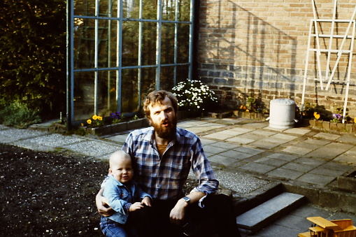 Young father in the eighties with his toddler son