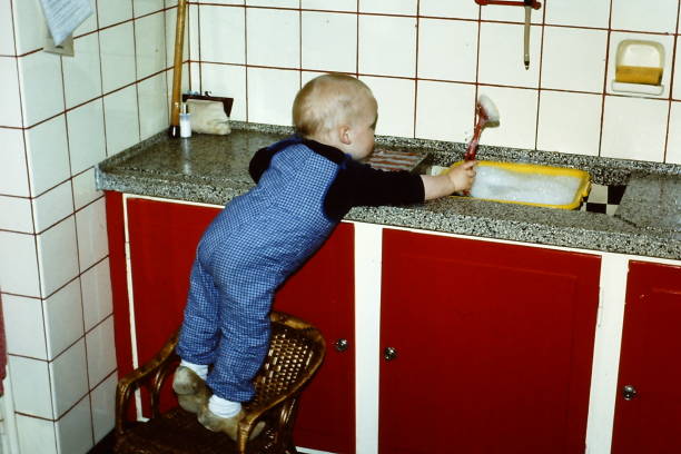 istock Toddler boy helping in the kitchen 1471676819