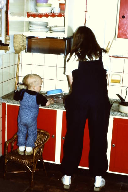 istock Toddler boy helping in the kitchen 1471676836