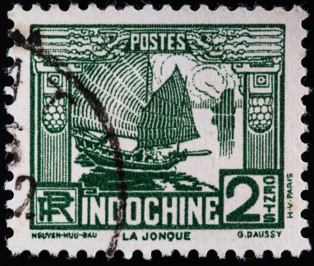 Chinese junk sailboat on a old postage stamp from Indochina.