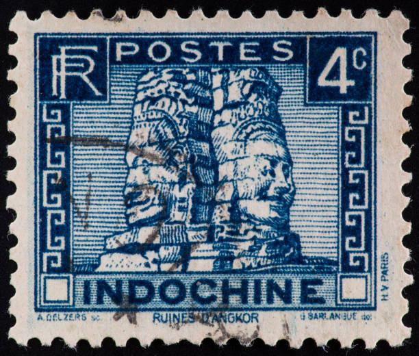 istock Stone faces on Bayon Temple, Ankor Wat, Cambodia on an old postage stamp from Indochina. 1471677889