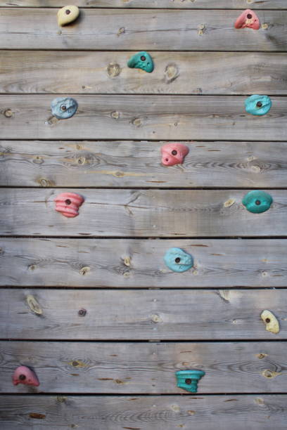 istock A rock climbing wall with a blue and red painted top. 1471678801