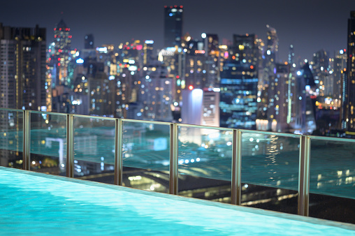 Night view cityscape rooftop swimming pool view bangkok city thailand