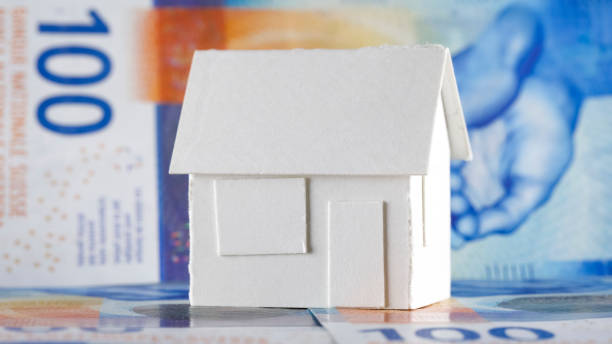 istock White paper house model and Swiss banknotes 1471681154