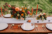 Table settings at an outdoor wedding reception