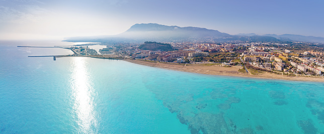 Denia aerial skyline in Mediterranean Alicante of Spain Drone point of view Costa Blanca with Montgo mountain in the morning